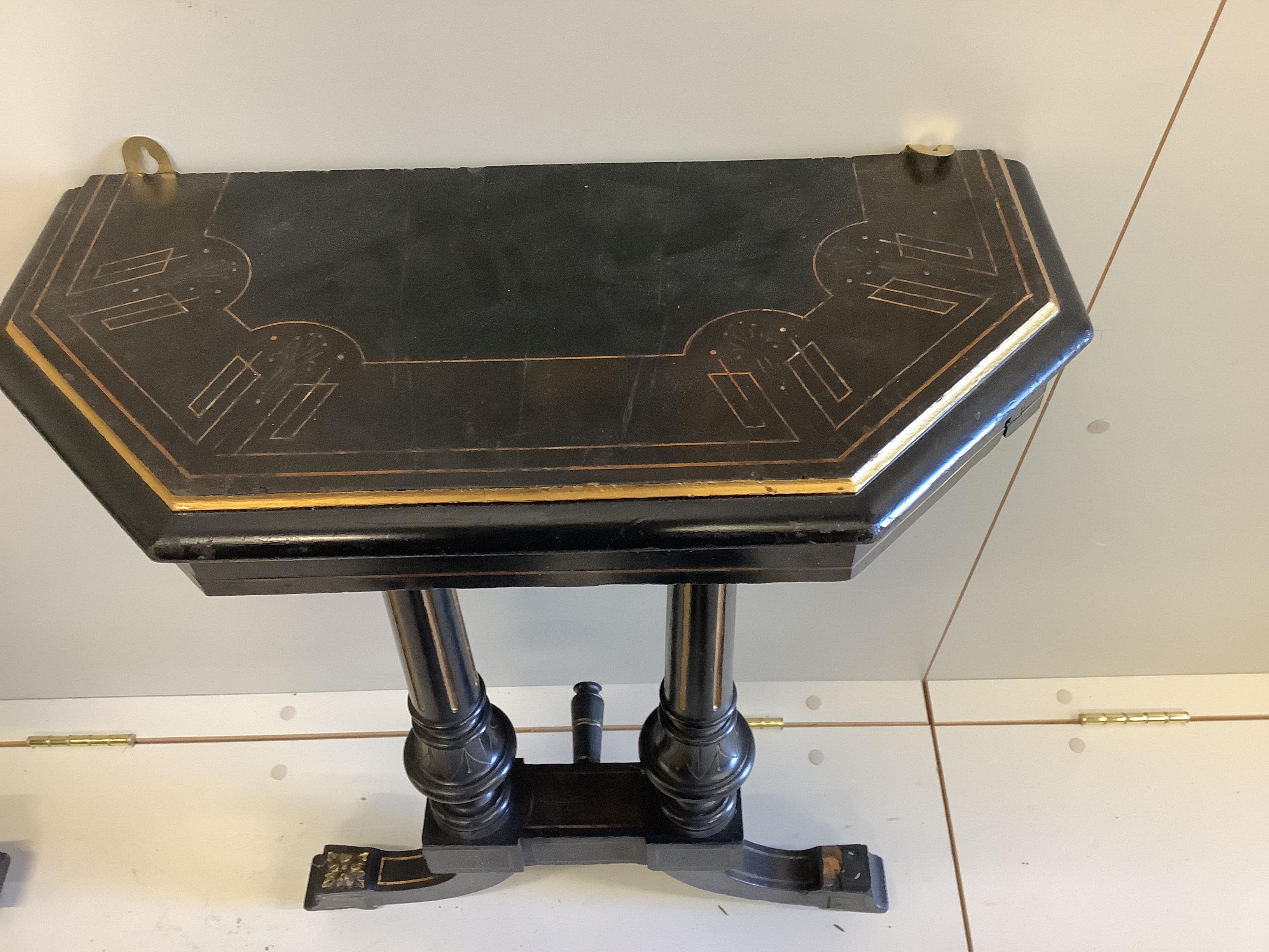 A pair of late Victorian ebonised hall tables, altered, width 53cm, depth 26cm, height 76cm.